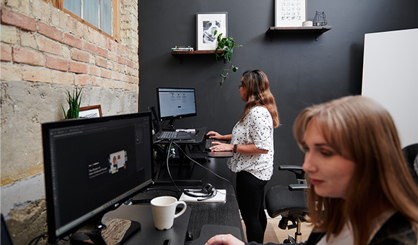 Two designers working on website content